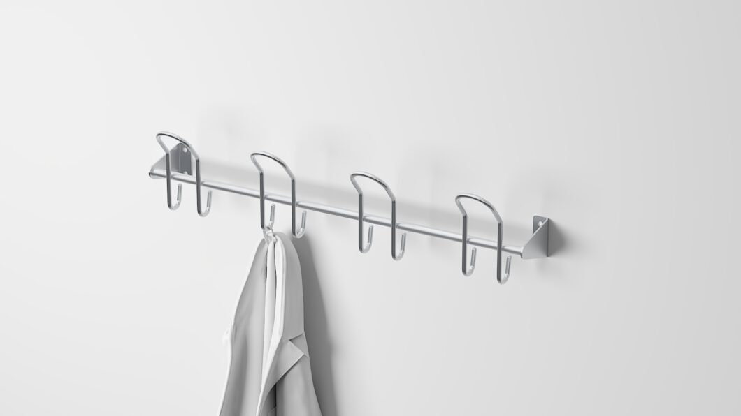 Stainless steel coat rack with 4 double pegs, ideal for hygienic storage of workwear, jackets, and accessories.