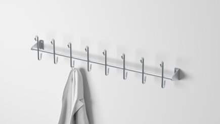 Stainless steel coat rack with 8 single pegs, ideal for organizing coats, aprons, and work gear in industrial or commercial spaces.