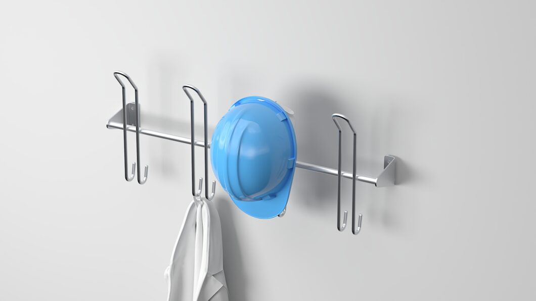 Stainless steel helmet hook rack with four double hooks holding a blue helmet and work gear.